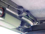 front header clip shown sandwitched between header and windshield
